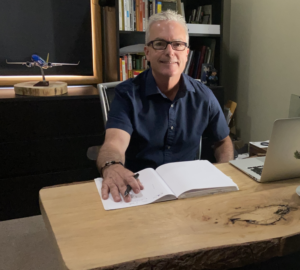 Ron at desk writing